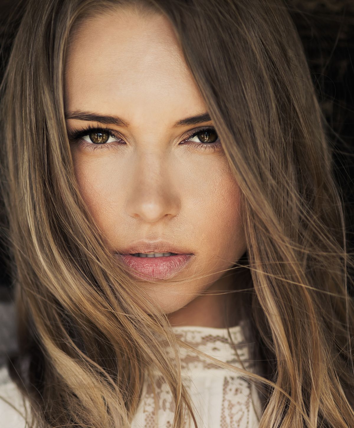 Portrait of a woman with flowing hair.